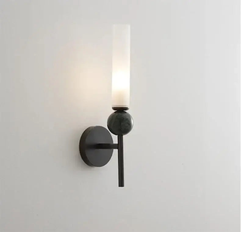 Black metal DecorBites marble sconce wall light with frosted glass cylinder and spherical accent for elegant lighting