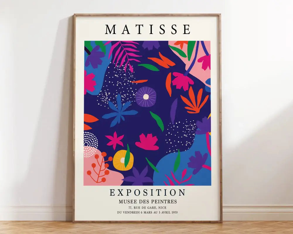 A vibrant framed matisse floral art print featuring bold pink orange blue and purple patterns on a navy background