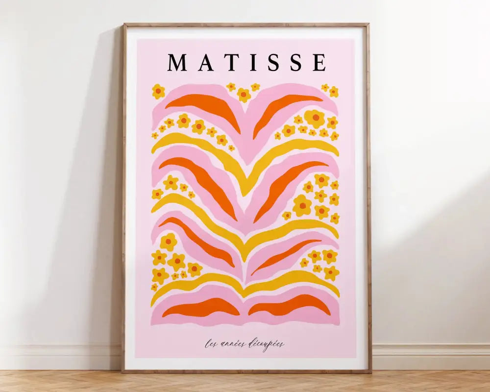 A framed DecorBites™ matisse floral art print with bold pink, orange, and yellow floral patterns on soft pink background