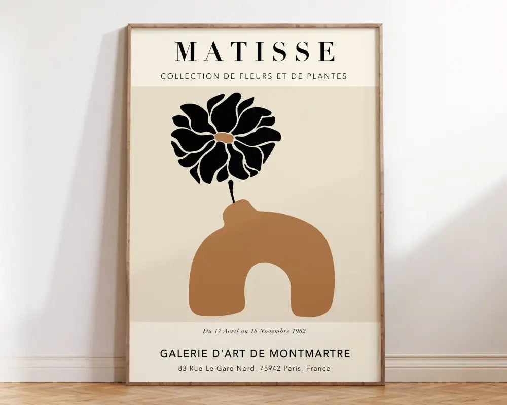 Beige-framed decorbites™ matisse floral art print featuring a stylized black flower in an ochre vase in minimalist style