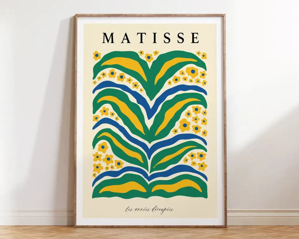 A framed DecorBites™ matisse floral art print with bold green yellow and blue abstract floral patterns and matisse text
