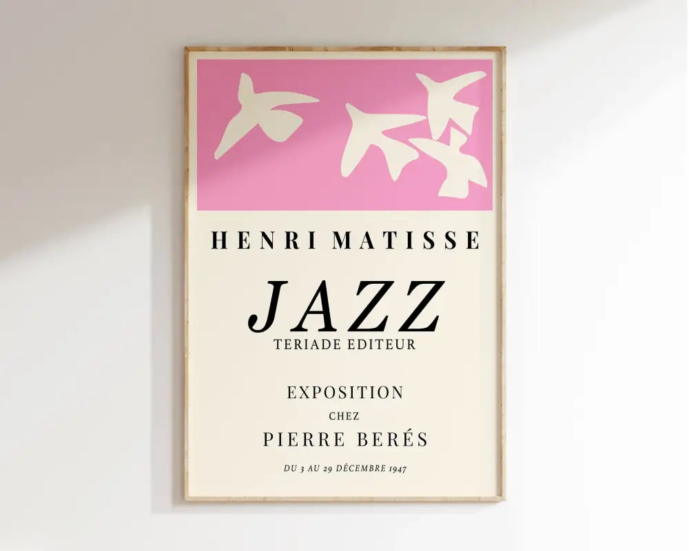 A framed matisse floral canvas print with pink bird silhouettes and black text on an off-white background
