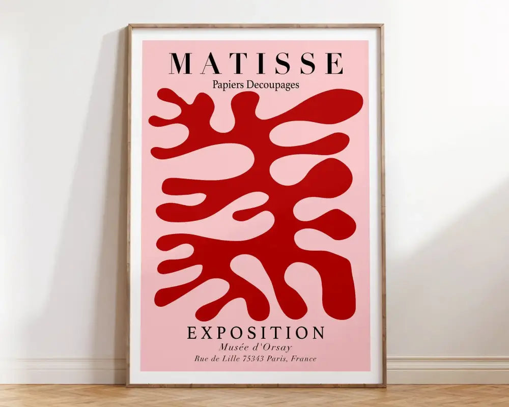 Framed matisse floral canvas print with bold red abstract shapes on pink background in minimalist wooden frame