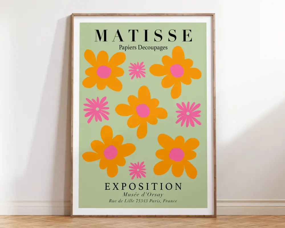 A framed abstract flowers canvas print featuring bold orange and pink matisse floral design on light green background