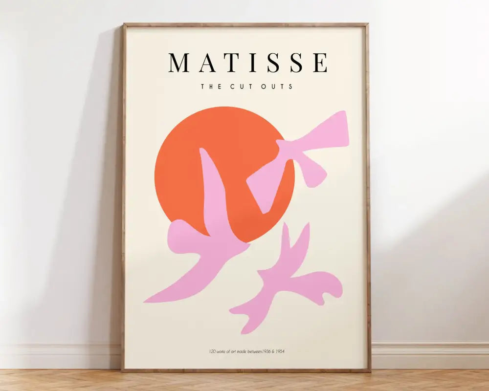 A framed decorbites™ matisse floral print featuring bold pink and orange cut-out silhouettes on cream background