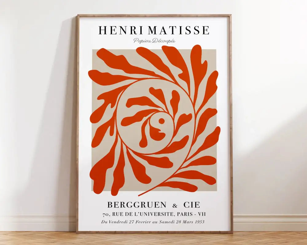 A framed art print from DecorBites™ matisse floral prints collection with bold orange leafy spiral on beige background