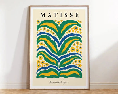 A framed matisse flower poster with bold green yellow and blue abstract floral patterns on canvas prints by decorbites