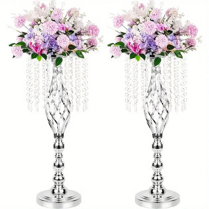 Two elegant silver metal flower vases with twisted design and artificial pink purple white flowers for wedding centerpieces