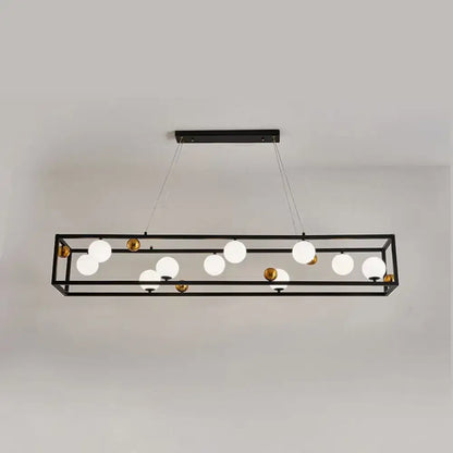 Black metal rectangular chandelier with gold-toned accents and milk glass shade for industrial dining rooms