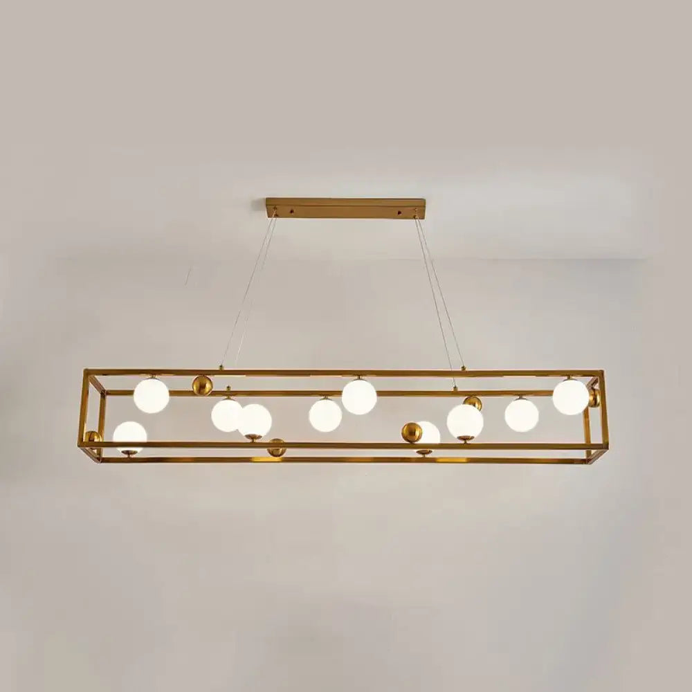 Gold-toned rectangular DecorBites metal pendant light with multiple frosted milk glass shade globes for industrial dining rooms