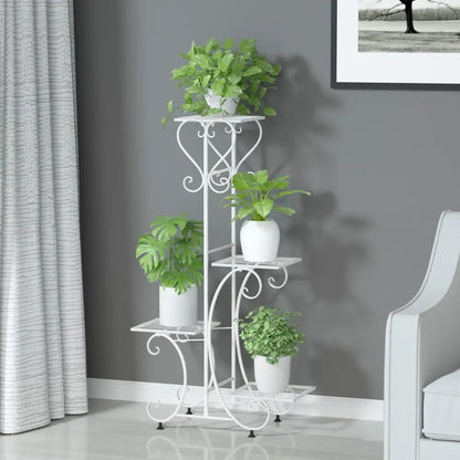 White wrought iron metal plant stand with ornate scrollwork and four tiers for holding four flower pots by DecorBites