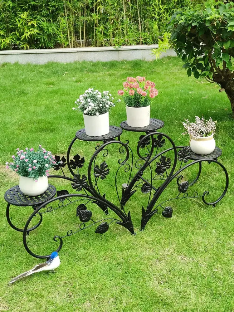 Decorbites metal plant stand set for 4 potted flowers with black wrought iron ornate leaf design and white ceramic pots