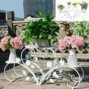 Decorbites™ white metal plant stand with three tiers and floral leaf designs for four potted flowers