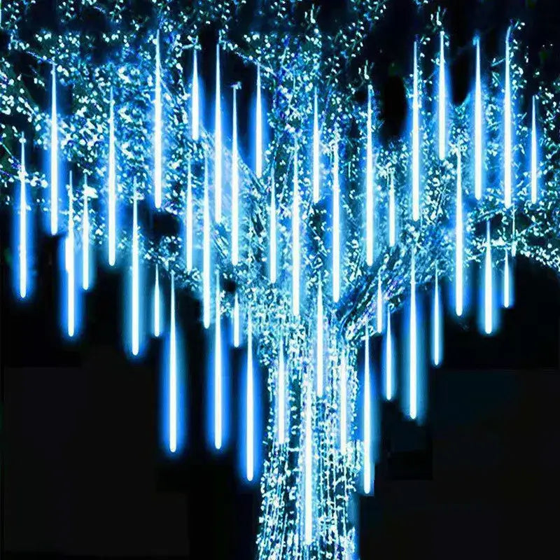 DecorBites™ meteor shower blue led string lights hanging from a tree for outdoor decor use