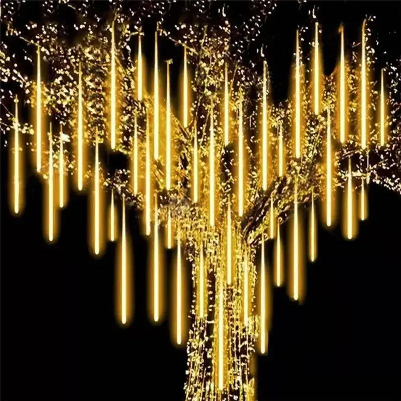 DecorBites™ meteor shower golden led string lights hanging from a tree for outdoor decor use