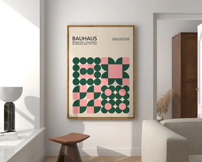 A mid century canvas print featuring a green and pink geometric bauhaus design on off white background for home decor