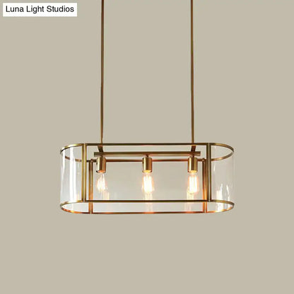 Brass-framed mid century pendant light with translucent glass panels and three exposed filament bulbs in an oval cage design