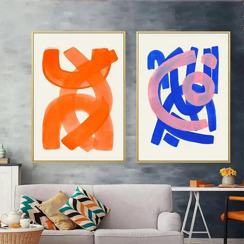 Two decorbites™ mid century watercolor brush strokes canvas prints featuring bold orange and blue brushstrokes in gold frames