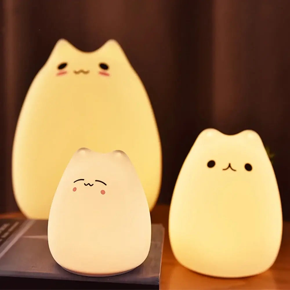 Three soft-glowing decorbites™ mini popular cat night lamps with blush pink cheeks and power switch for bedside use
