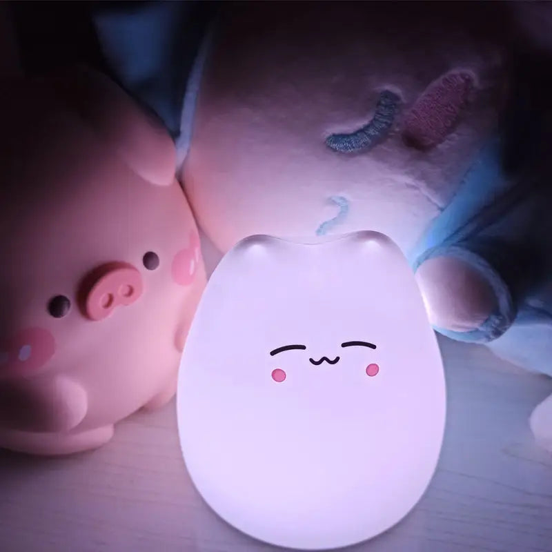 DecorBites™ mini popular cat night lamp with power switch soft glowing white egg shape smiling face rosy cheeks color-changing