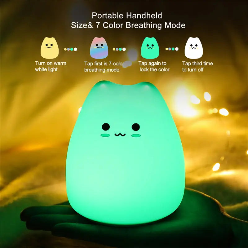 A soft glowing green mini popular cat night lamp with power switch and cute face design for bedroom use
