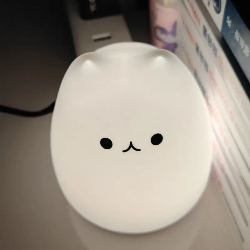 Decorbites™ mini popular cat night lamp with smooth white surface, smiling face, power switch, 7-color touch eye protection