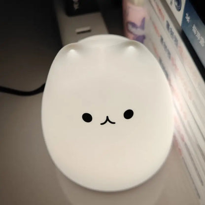 Decorbites™ mini popular cat night lamp with smooth white surface, smiling face, power switch, 7-color touch eye protection