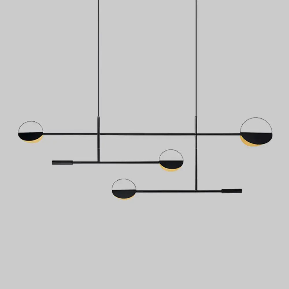 Modern black and gold geometric pendant light fixture with minimalist design for dining room by decorbites