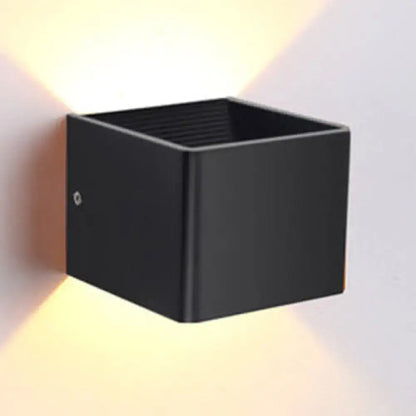 Black matte finish sconce light with dual-directional lighting from decorbites minimalist cube shade for living room decor