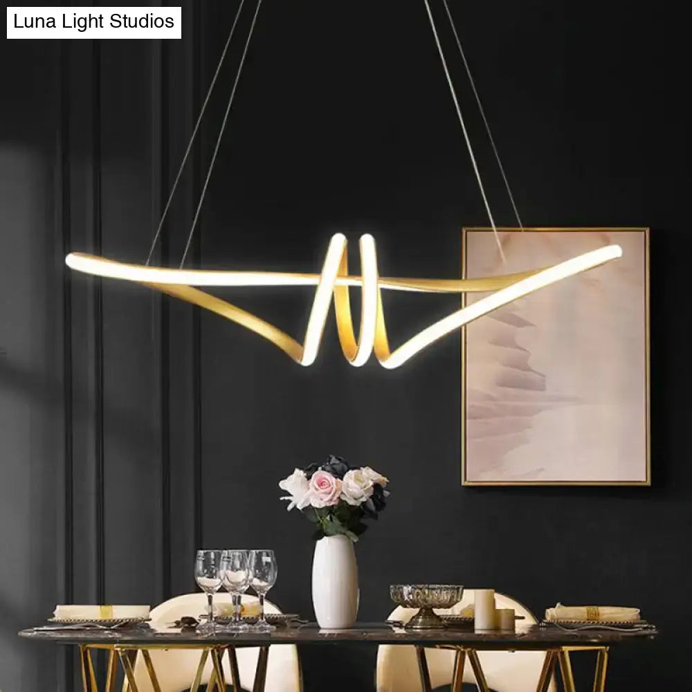 Gold-toned led twist island pendant light fixture with sleek curved arms and metal finish perfect for restaurants
