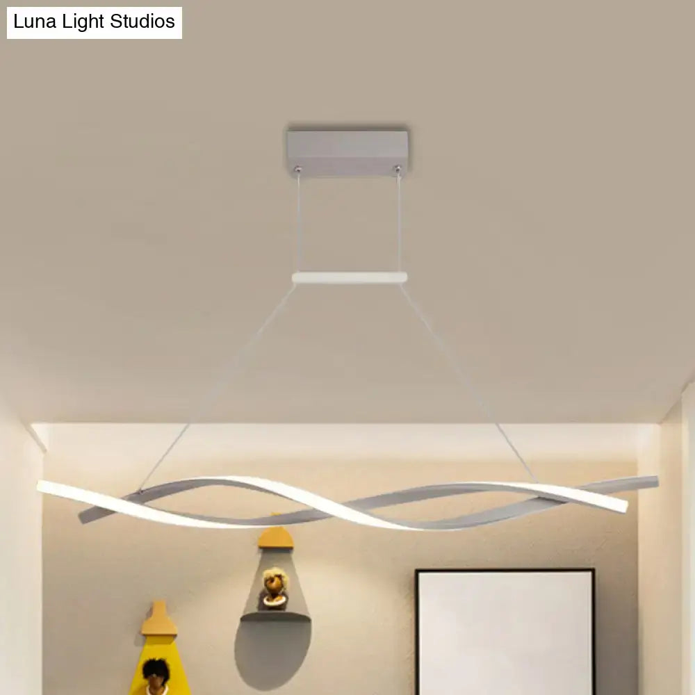 Modern silver and white DecorBites minimalist linear LED pendant light with sleek wave acrylic shade for restaurants