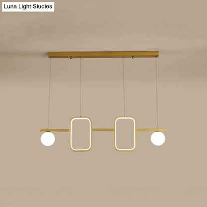 Modern gold-toned DecorBites™ minimalist metal pendant light with symmetrical geometric LED and cream glass shade with color remote control