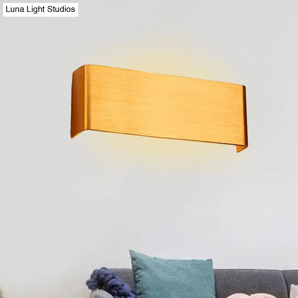 Modern gold finished rectangular wall lamp with sleek minimalist design for living room with warm white light