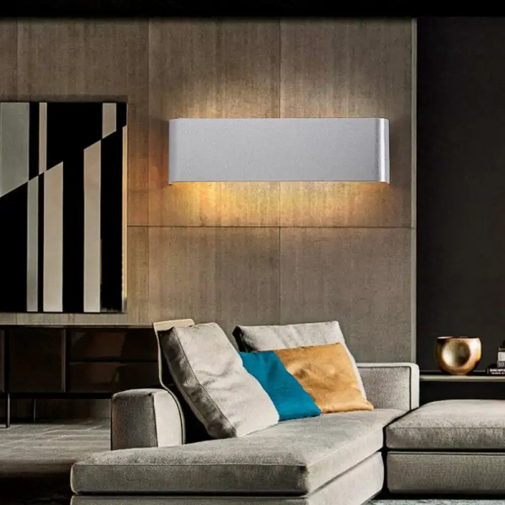 Modern rectangular wall lamp with sleek white metallic finish and warm white light for living room ambiance