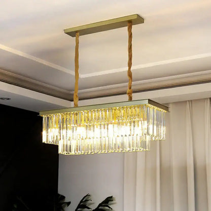 Gold-toned rectangular pendant light with minimalist prismatic crystal prisms and twisted rope suspension for restaurants