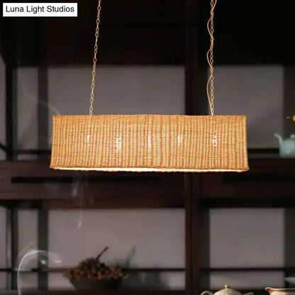 Decorbites minimalist rectangular woven rattan restaurant hanging lamp with 3 heads and warm golden glow