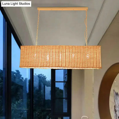 Decorbites minimalist rectangular woven rattan restaurant hanging lamp with natural tan finish and gold chain suspension