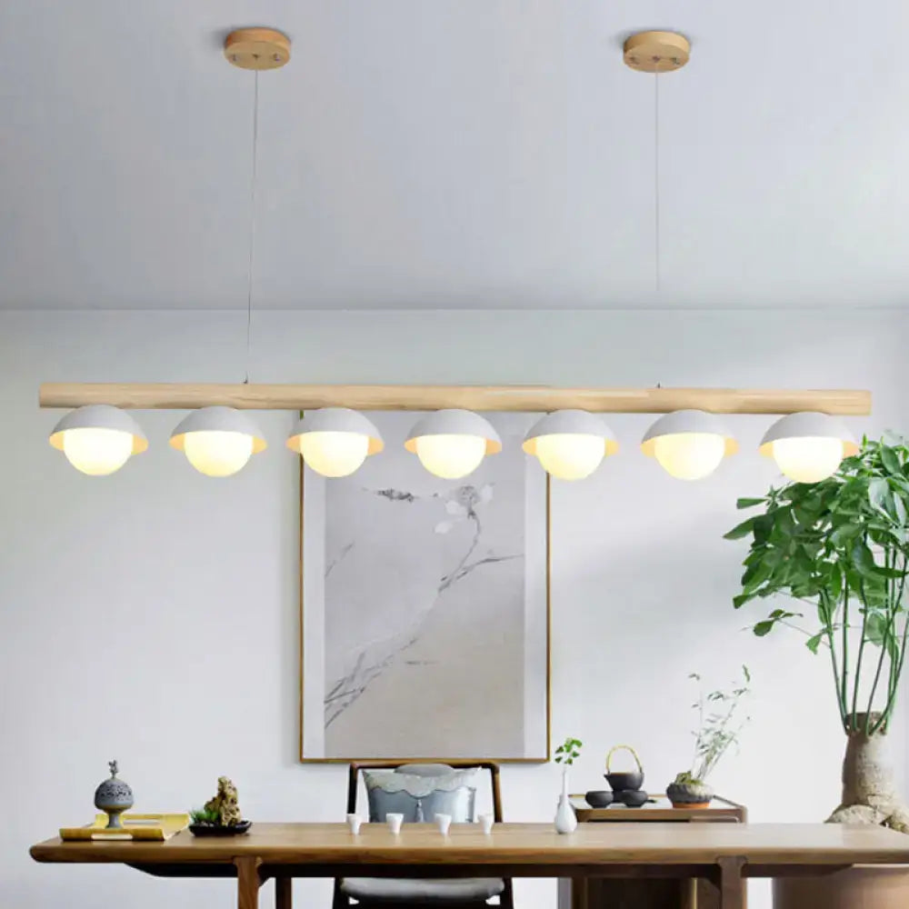 DecorBites minimalist wood island pendant with natural wood bar and six grey dome-shaped matte lampshades