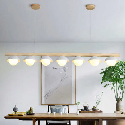 DecorBites minimalist wood island pendant with natural wood bar and six grey dome-shaped matte lampshades