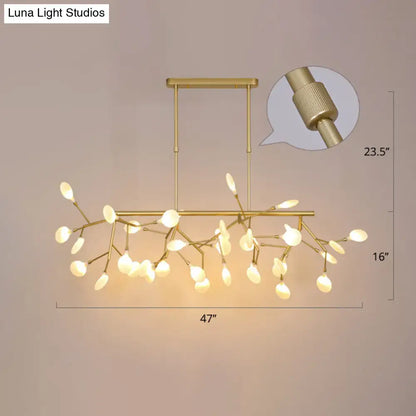 Gold-toned acrylic twig ceiling pendant with frosted glass leaf lights for minimalistic dining room decorBites dining room