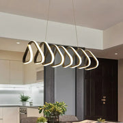 Modern pendant island light with sleek interlocking brushed gold metal rings and warm white LED for dining room ceilings