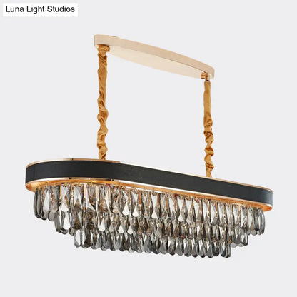 Elegant black and gold DecorBites™ modern 10-light beveled crystal island pendant with leather band and gray crystal teardrops
