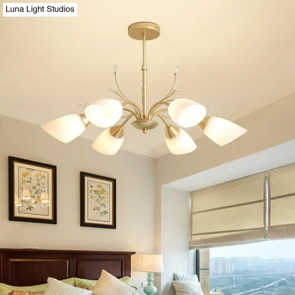 Gold-toned decorbites modern hanging chandelier with six frosted glass shades and central brass finish