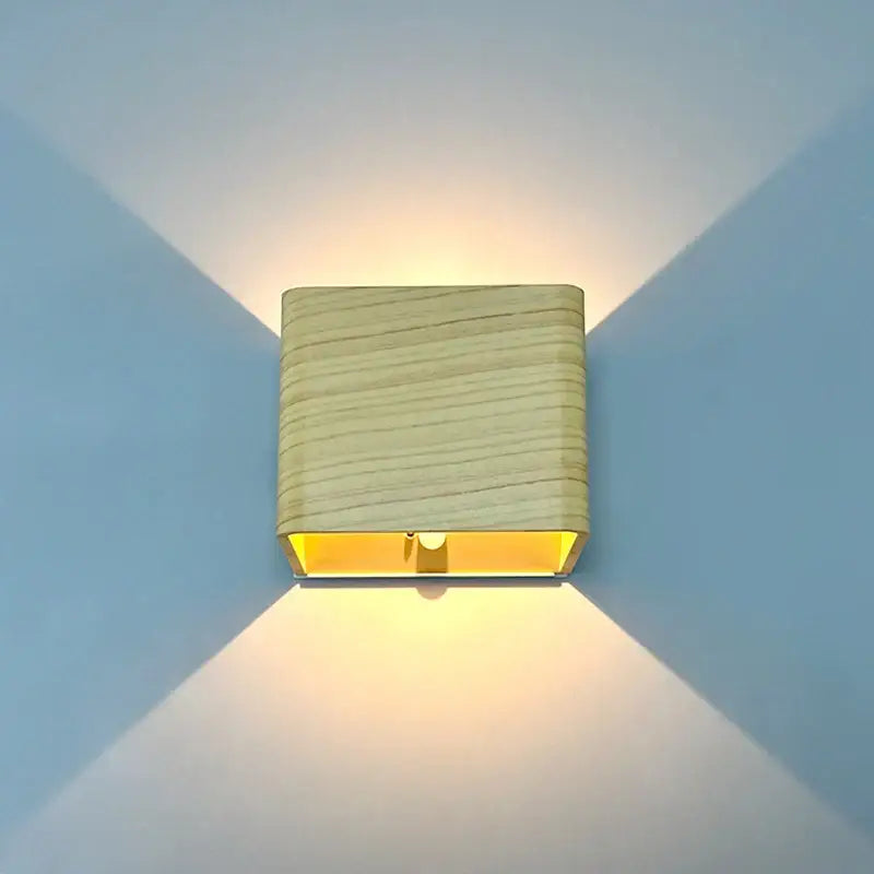 DecorBites™ modern battery operated square wooden wall sconce emitting a warm yellow glow for ambient lighting