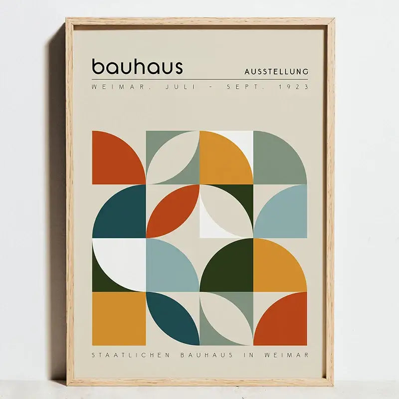 A framed DecorBites™ modern bauhaus exhibition poster with geometric semicircles in orange, teal, olive green, and blue on canvas