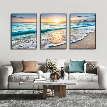 DecorBites modern three-panel beach sunset canvas set with black frames featuring turquoise waves and golden sunset hues