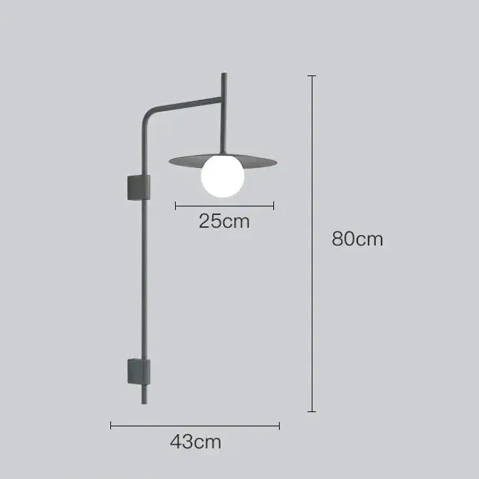 Decorbites™ modern bedside wall light with matte black metal arm and spherical white glass bulb in flat circular shade