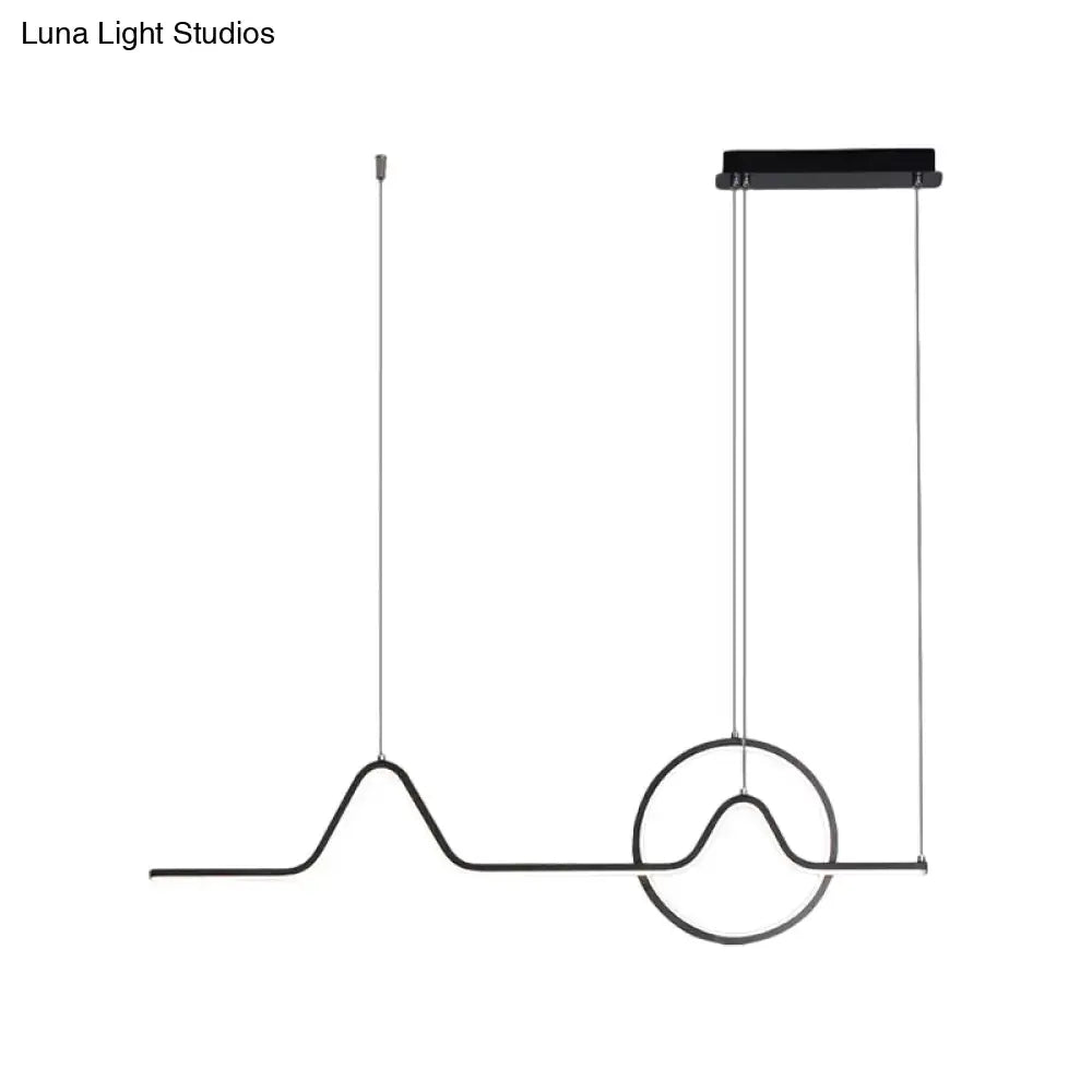Black minimalist pendant ceiling light with wave-like wire design and circular accent providing warm white light
