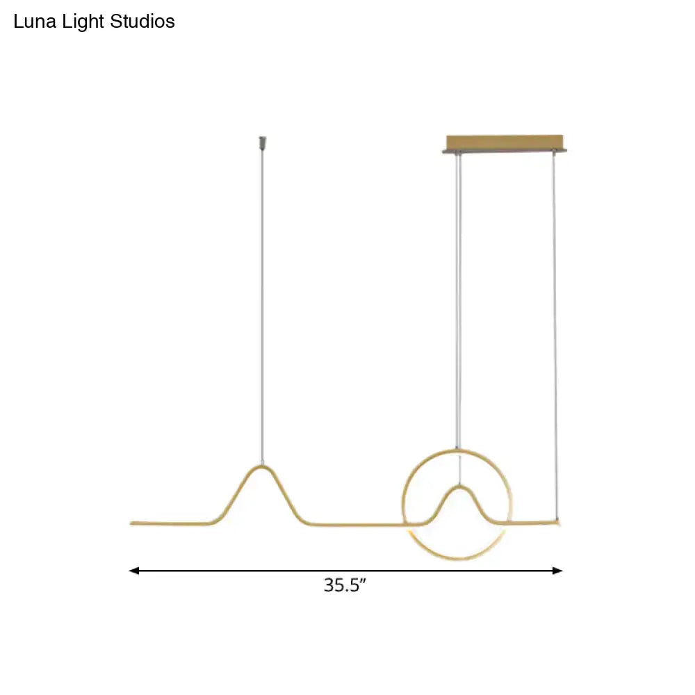 Gold-toned minimalist aluminum pendant ceiling light with wave design and warm white light by DecorBites™