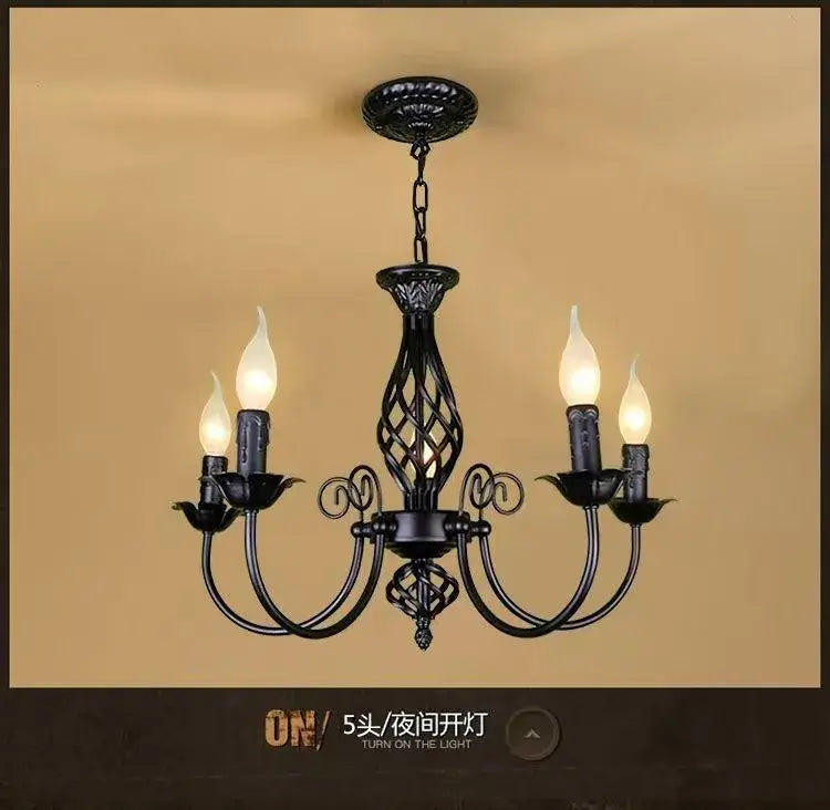 Decorbites modern black iron chandelier with ornate scrollwork and five candle-style bulbs for living room use